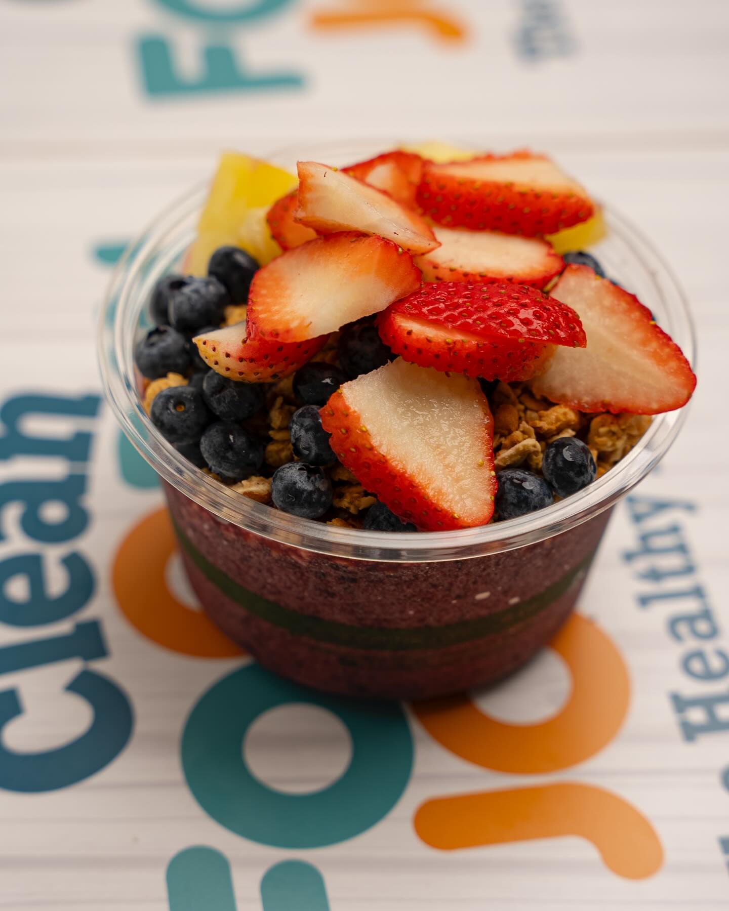 Acai bowl topped with fresh fruits and granola