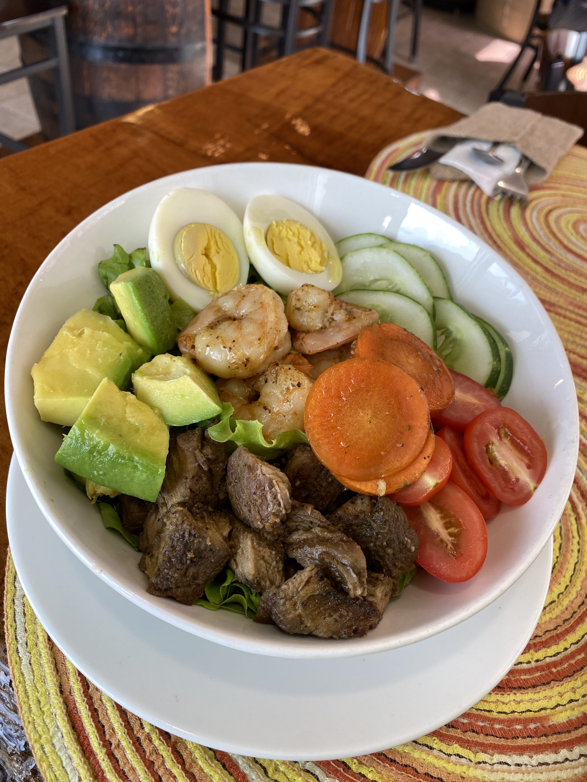 Fresh power bowl with shrimp, avocado, egg and veggies